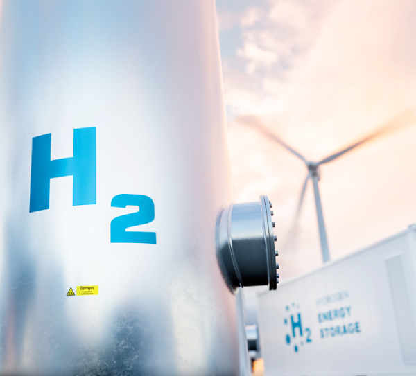 Quarterly Newsletter May 2022 Saldanha Bay as a hydrogen hub showing Hydrogen tankers with renewable energy turbines in the background